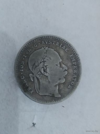 Старая монетка серебро наверное.