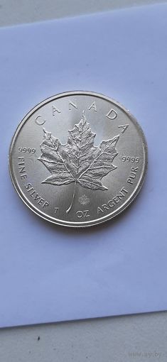 5 долларов 2014 года Канада. Серебро 999. Кленовый лист /маленький лист под большим/.